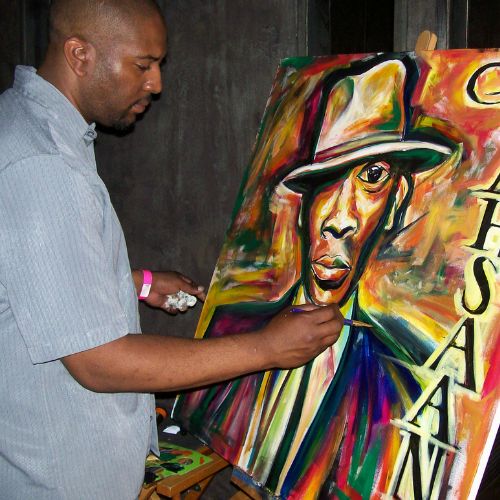 Corey Barksdale live painting a portrait at a brand event