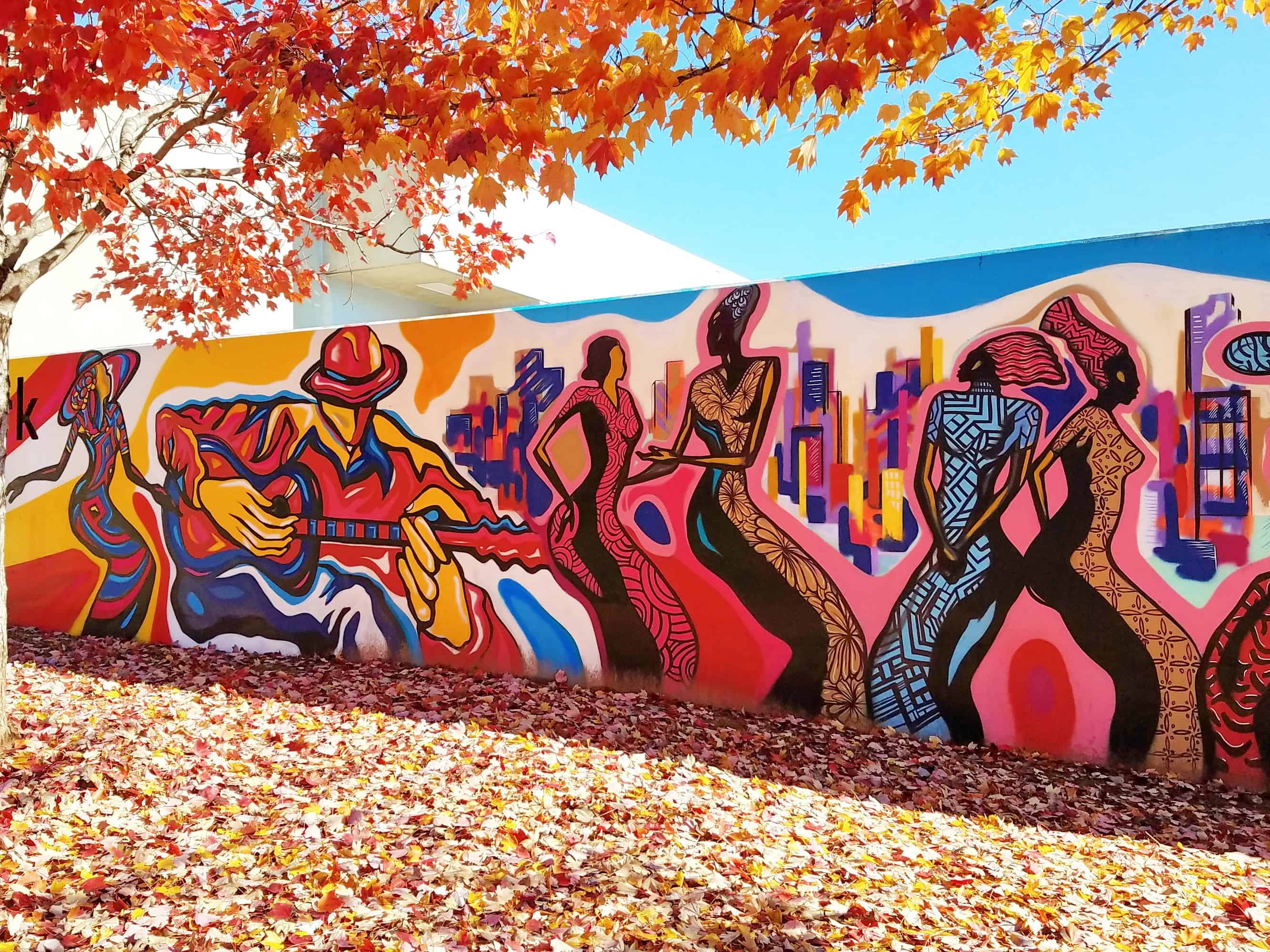 Guitarist and dancers, Pittman Park mural by Corey Barksdale, Atlanta skyline