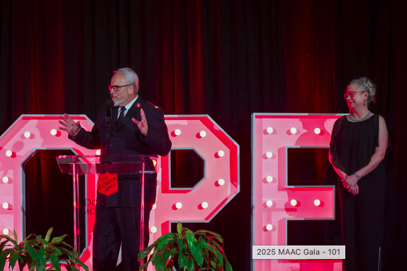 Salvation Army officer speaking at the Doing The Most Good Gala HOPE stage in Atlanta